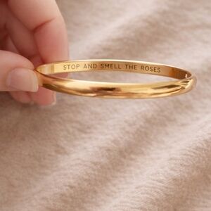 Kate Spade “Stop and Smell the Roses” Gold-Tone Idiom Bangle | Giftable Quote